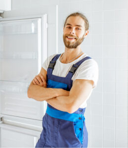 workman installing fridge on the kitchen at home 2021 09 02 09 18 44 utc